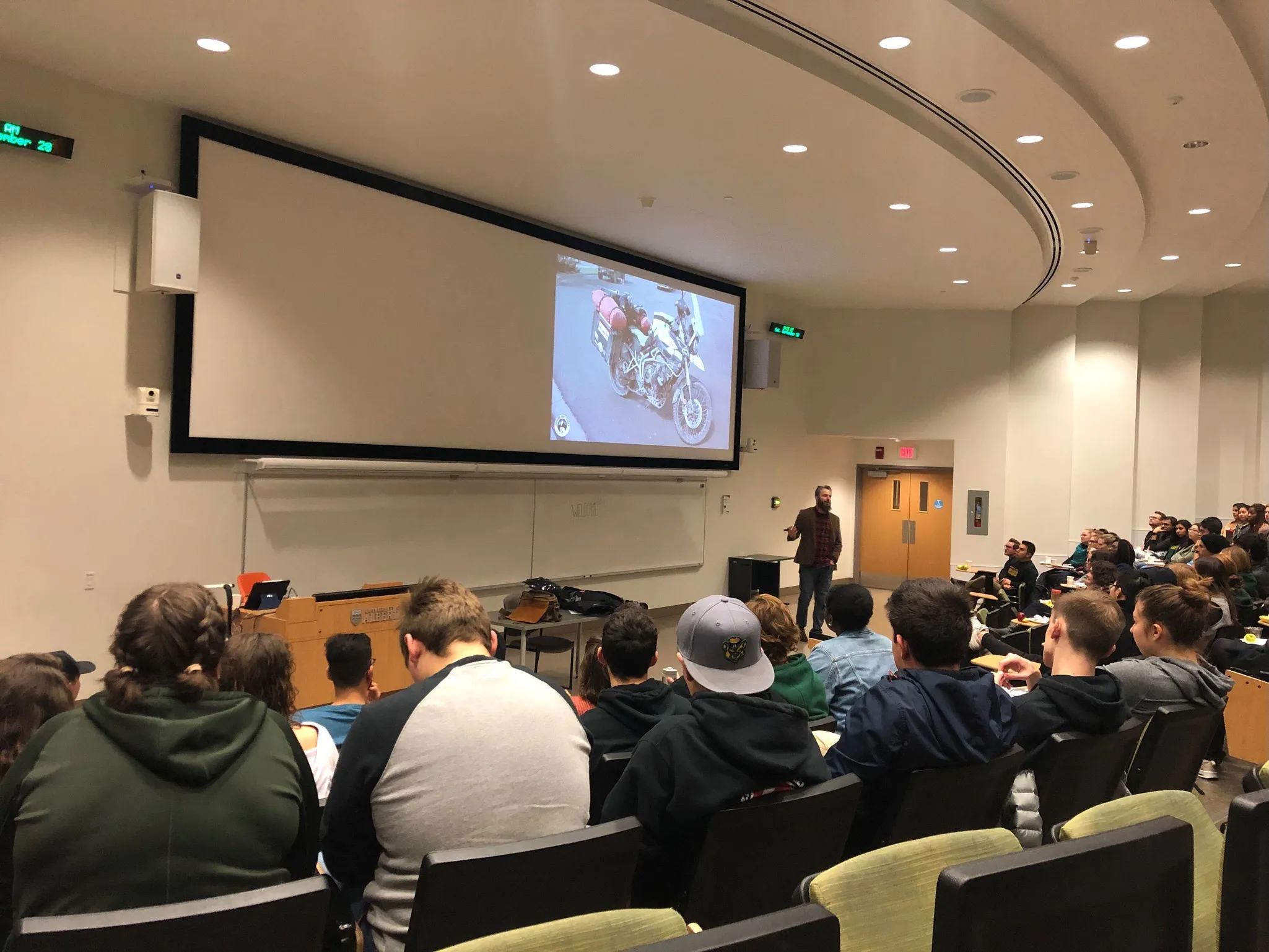 Craig presenting in front of a large crowd