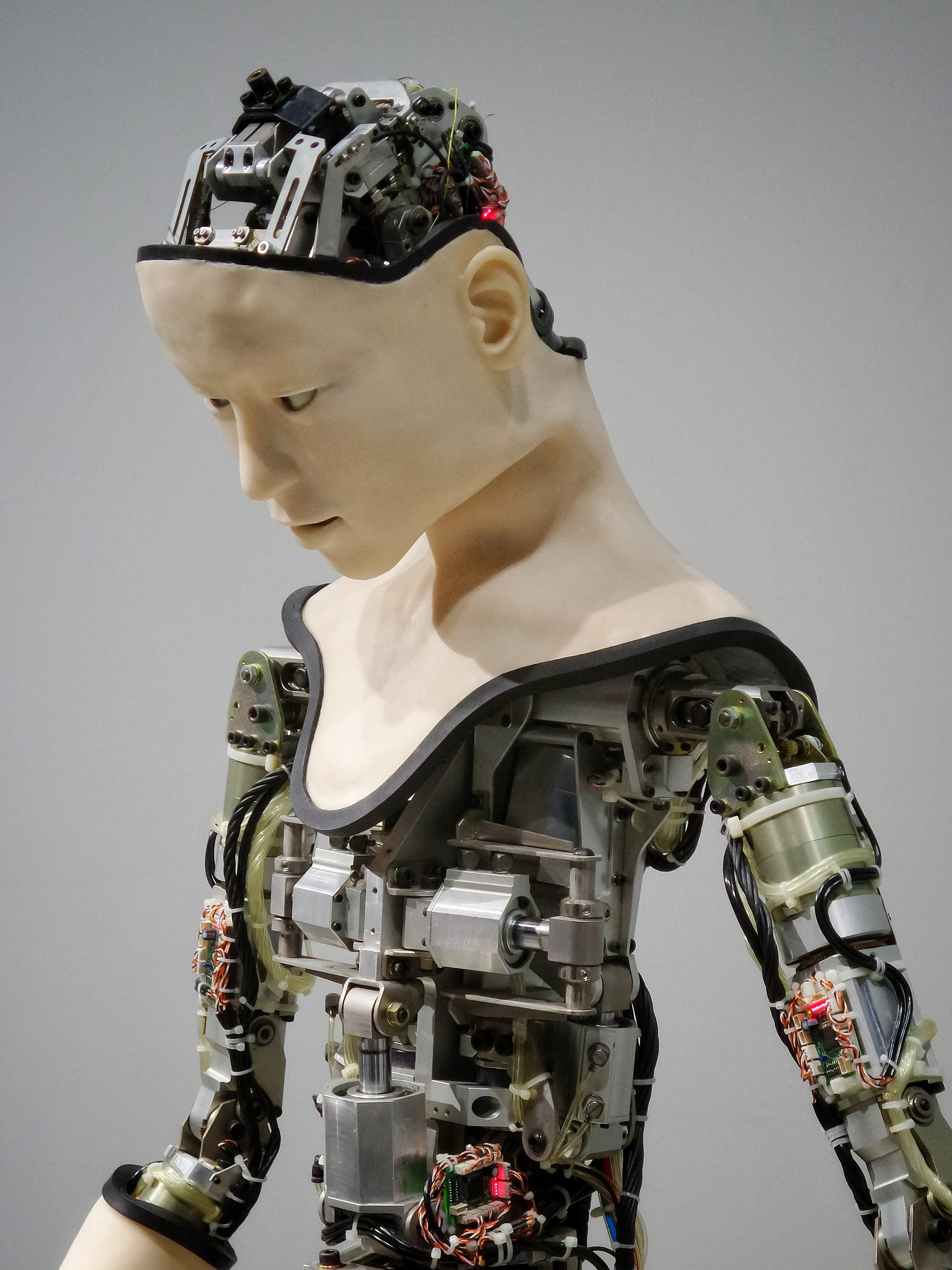 Robotic Humanoid with only partial skin showing it's servos and components
