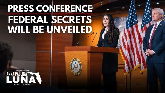 A press conference video thumbnail titled "Federal secrets will be unveiled", showing Congresswoman Anna Paulina Luna at a podium with US flags behind her.