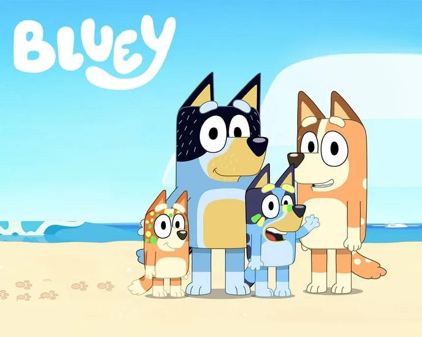 The Bluey title card, with the four dogs of the Heeler family standing together on a beach.